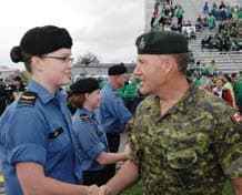 Canadian Army General and Navy sailor shaking hands